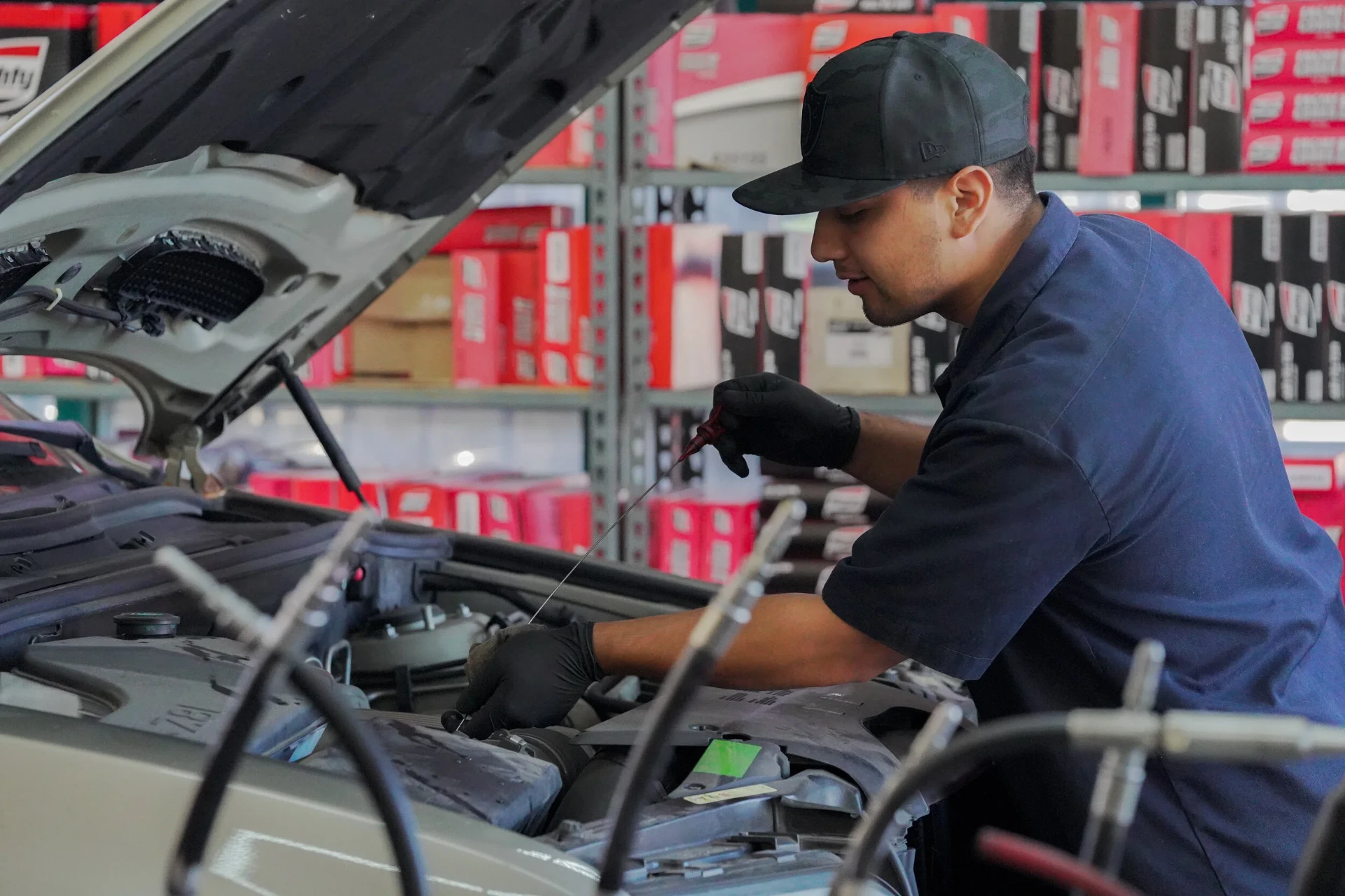 19-point courtesy inspection — technician working under the hood
